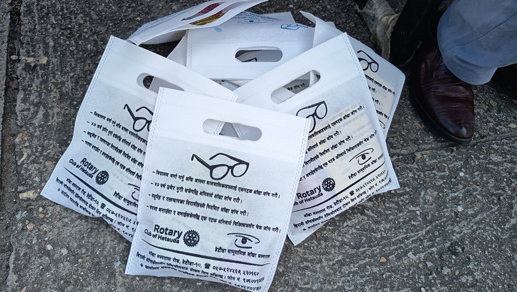 Rotary logo bags distributed to patients undergoing eye treatment