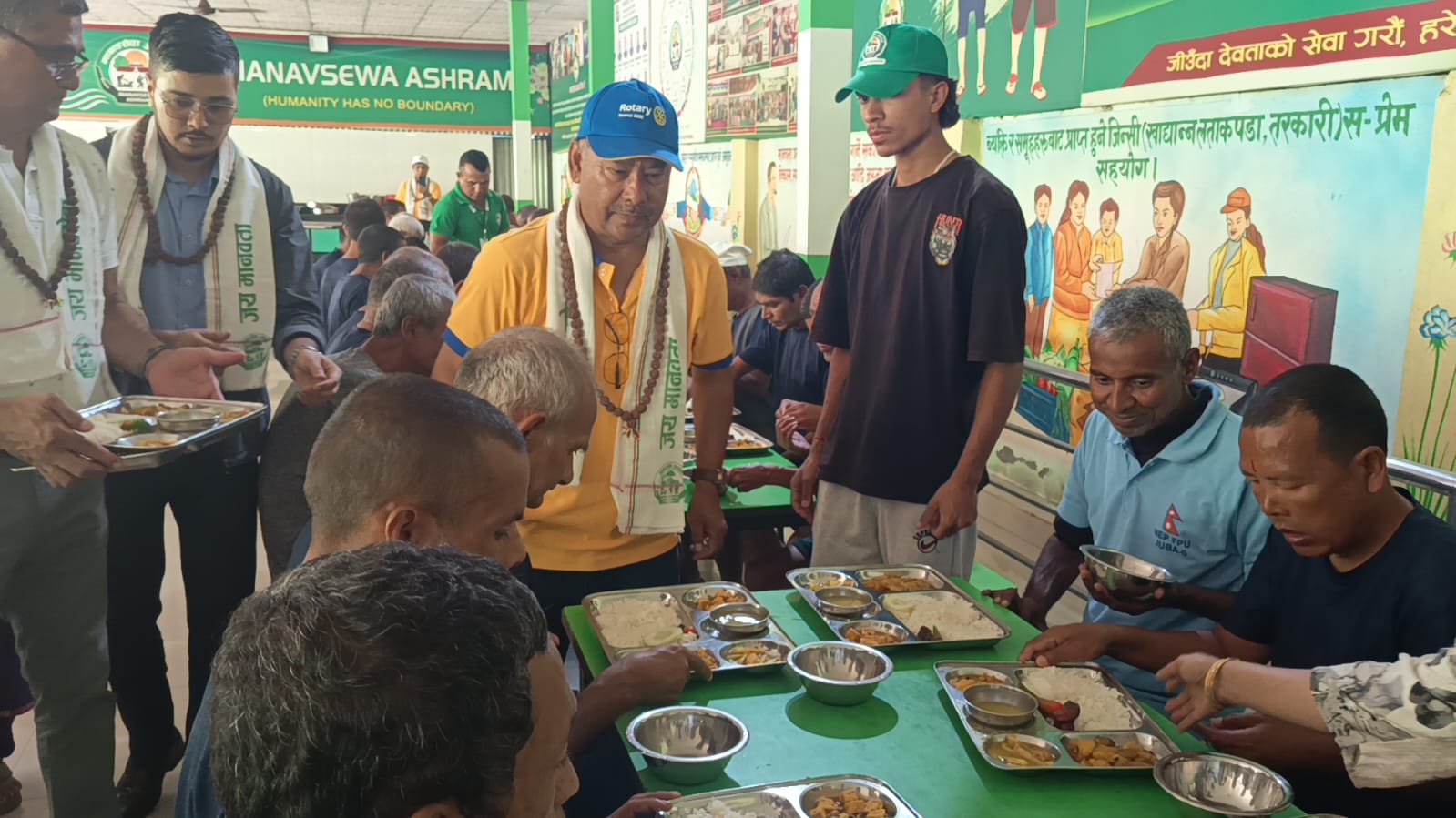 Meal service at Manav Sewa Ashram on the occasion of the club's charter day
